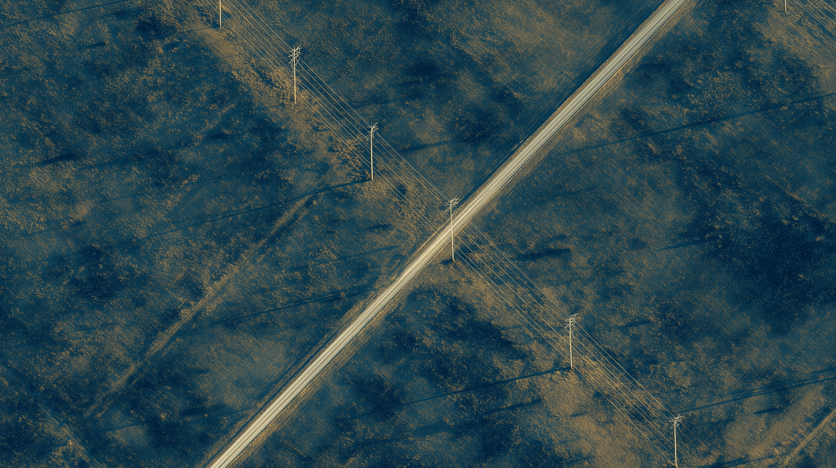 Aerial view of transmission corridor across open land